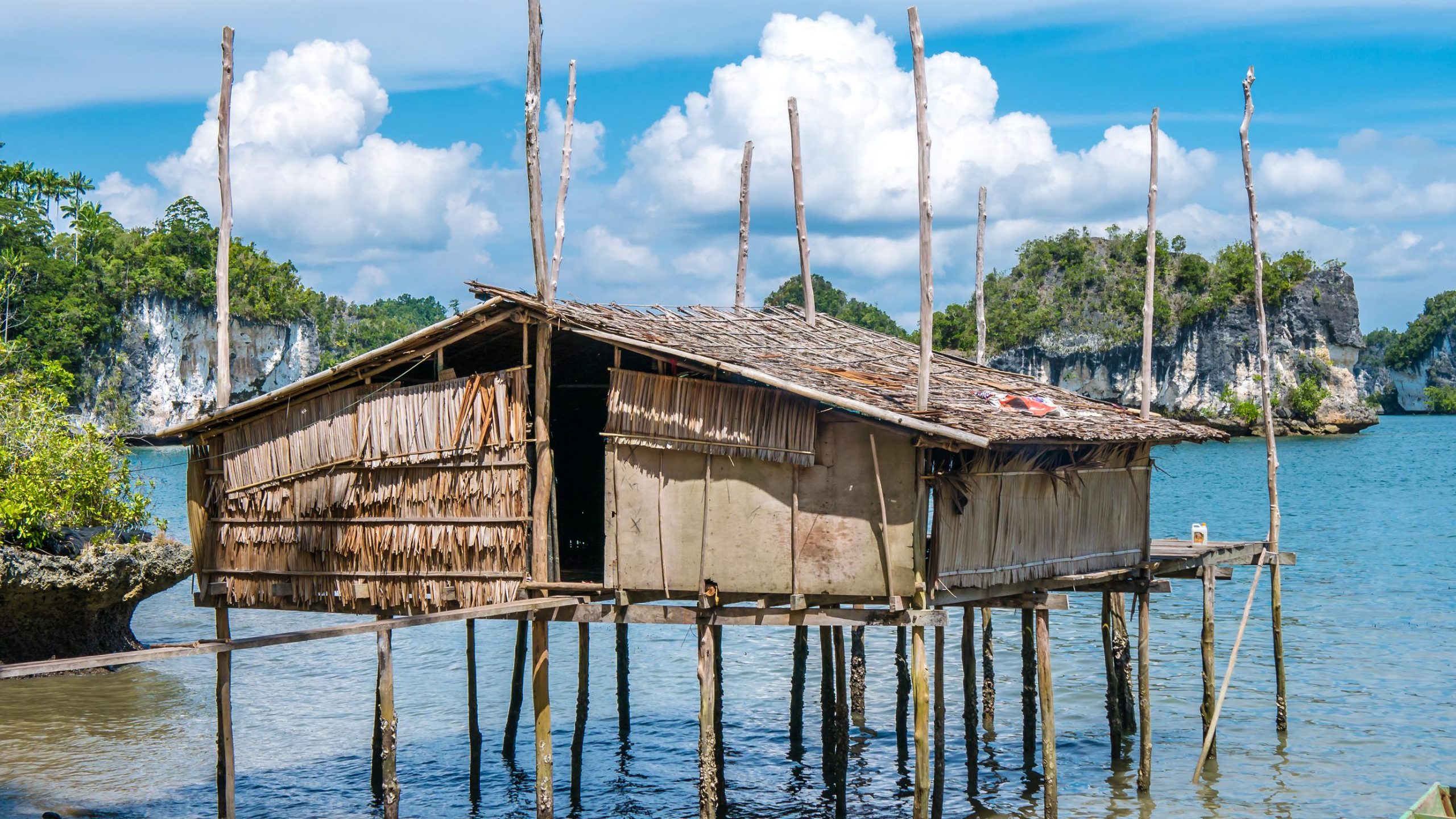 Bamboo hut on stilts over the water in Rajat Ampat