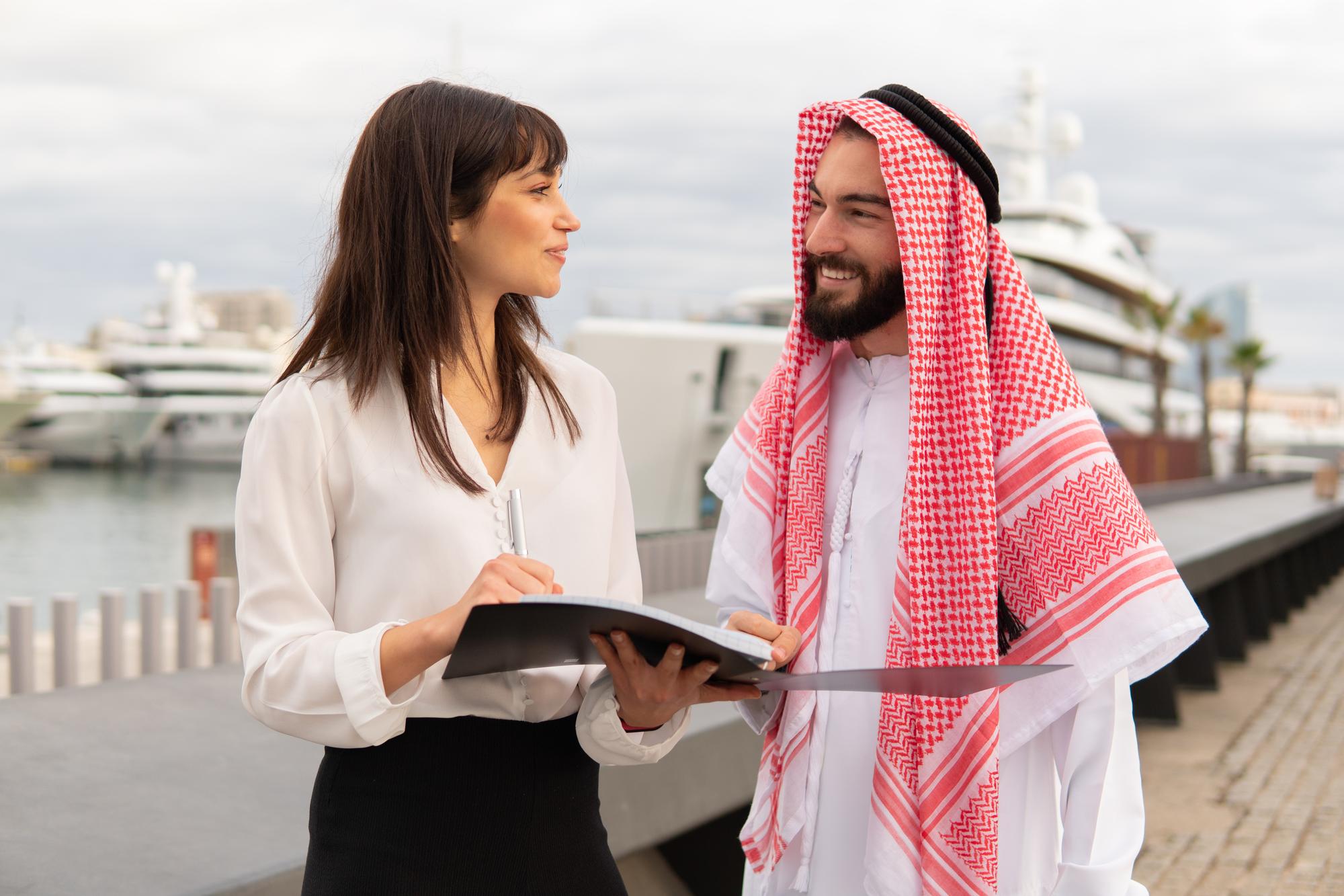 Female Yacht Broker selling boat to Arab Man