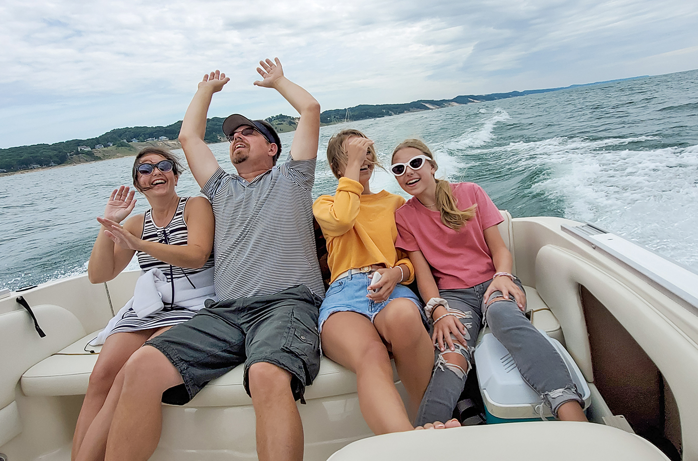 American Family Having Fun On A Boat